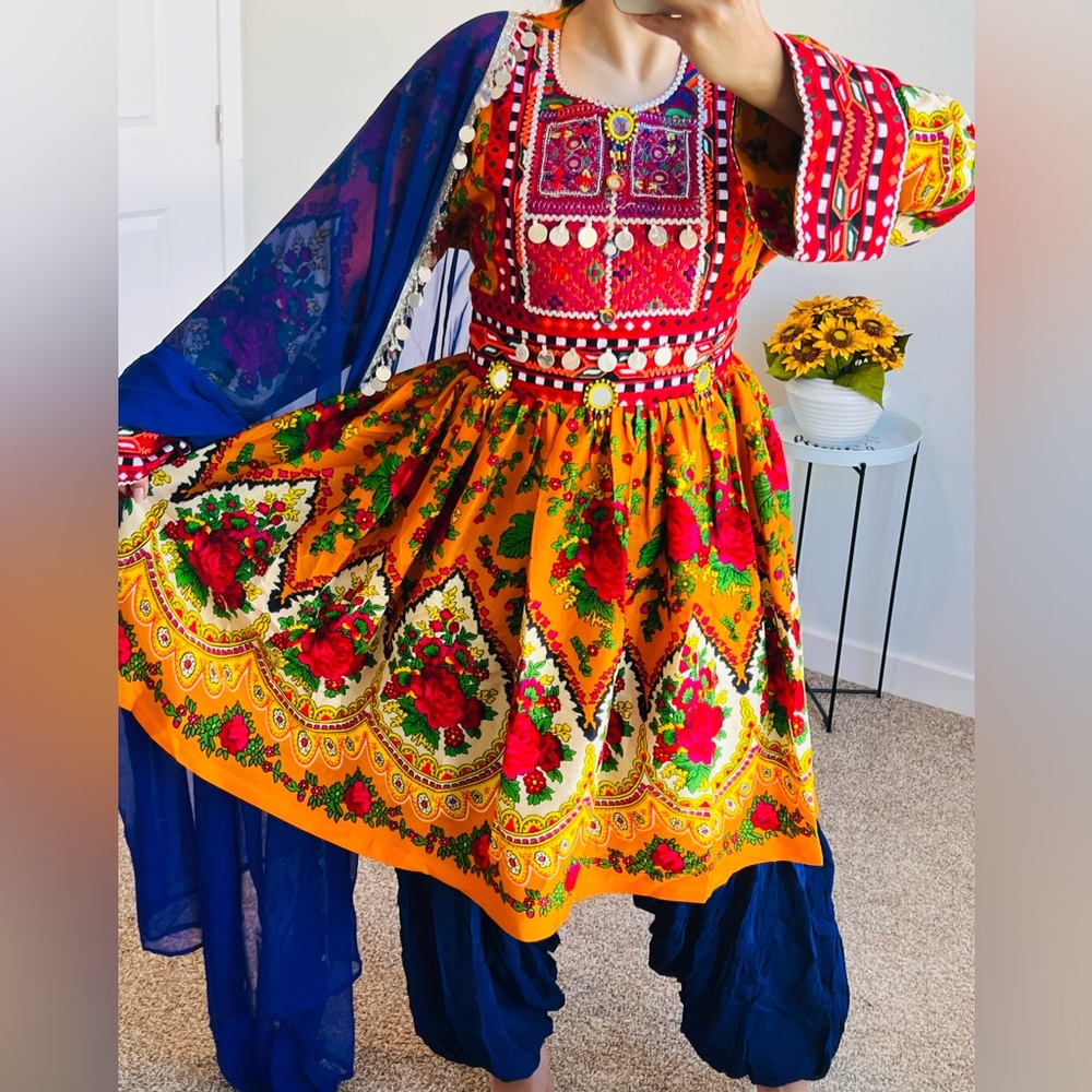 Stylish dress with trousers and a stylish scarf in orange and dark blue